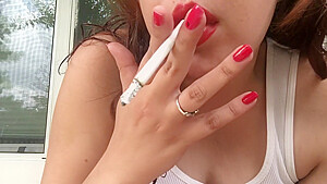 Sexy brunette teen smoking in white...