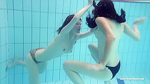 Mia and petra undress eachother swimmingpool...