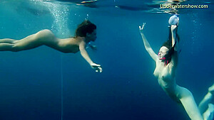 Underwater sea young babes swimming nude...