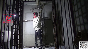 Straitjacket chinese girl in dungeon...