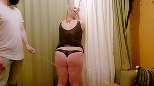 Redhead Submissive Endures Bamboo Spanking...