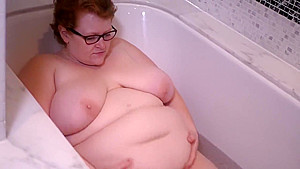 Feedee belly playing in bathtub...