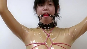 Rubber girl in breathplay...